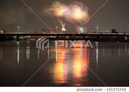 Fireworks reflected in the water Fireworks reflected in the water 141573348