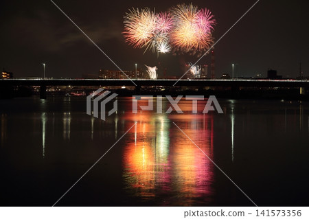 Fireworks reflected in the water Fireworks reflected in the water 141573356