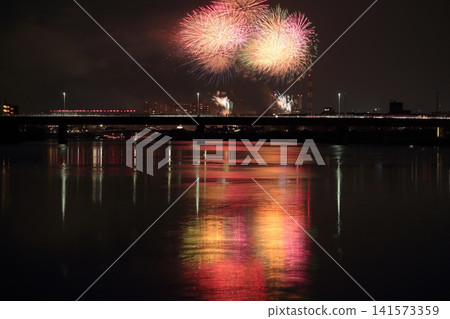 Fireworks reflected in the water Fireworks reflected in the water 141573359