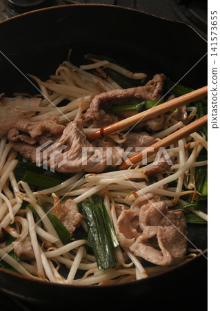 Pork chive bean sprouts being cooked Pork chive bean sprouts being cooked 141573655