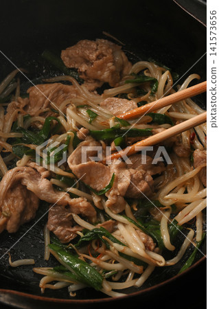 Pork chive bean sprouts being cooked Pork chive bean sprouts being cooked 141573656
