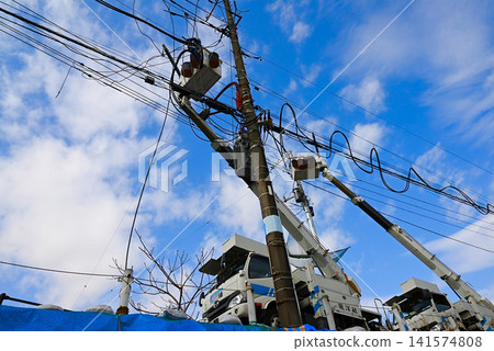 Power line and utility pole construction scene Power line and utility pole construction scene 141574808