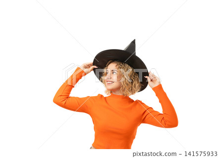 Person happily adjusts witch hat, isolated on white, PNG Person happily adjusts witch hat, isolated on white, PNG 141575933