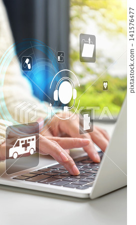 Close-up of hands typing on a laptop keyboard with digital icons representing telemedicine, ambulance, medical records, and customer support. Telehealth and online medical consultation concept Close-up of hands typing on a laptop keyboard with digital icons representing telemedicine, ambulance, medical records, and customer support. Telehealth and online medical consultation concept 141576477