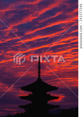 The silhouette of Yasaka Pagoda soaring against the sunset sky. The silhouette of Yasaka Pagoda soaring against the sunset sky. 141577248