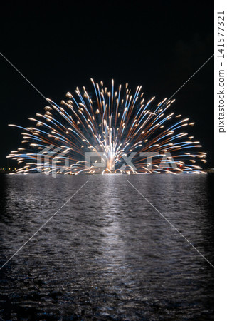 Large, spectacular fireworks light up the night sky at the Gamagori Fireworks Festival. Large, spectacular fireworks light up the night sky at the Gamagori Fireworks Festival. 141577321