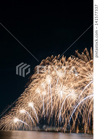 Large, spectacular fireworks light up the night sky at the Gamagori Fireworks Festival. Large, spectacular fireworks light up the night sky at the Gamagori Fireworks Festival. 141577337