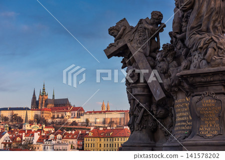 Prague Castle and Charles Bridge Sculpture Overlooking Historic Prague City Skyline Prague Castle and Charles Bridge Sculpture Overlooking Historic Prague City Skyline 141578202