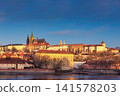 Golden Sunset Over Prague Castle and Historic Vltava River Waterfront Cityscape 141578203