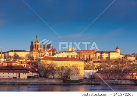 Golden Sunset Over Prague Castle and Historic Vltava River Waterfront Cityscape Golden Sunset Over Prague Castle and Historic Vltava River Waterfront Cityscape 141578203
