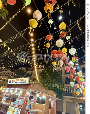 The night market scene on Phu Quoc Island, illuminated by lanterns. The night market scene on Phu Quoc Island, illuminated by lanterns. 141578521