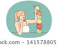 Woman builds fruit pyramid using organic food bought at farmers market to detox body 141578805