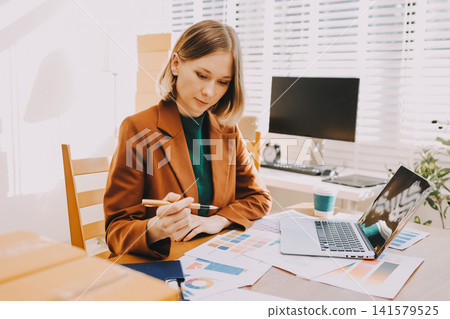 Logistics, small business woman with checklist for stock, clothes order or retail inventory management. Shipping, writing or person at ecommerce startup store for sme delivery with fashion designer Logistics, small business woman with checklist for stock, clothes order or retail inventory management. Shipping, writing or person at ecommerce startup store for sme delivery with fashion designer 141579525