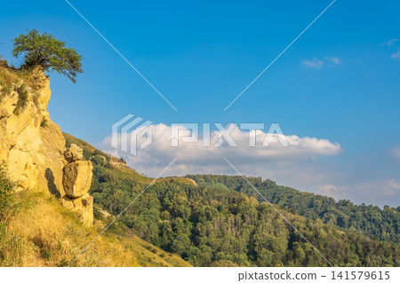 The Human Rock in Kislovodsk. Tourist attraction, Rock Man on the mountain Small saddle. Kislovodsk, North Caucasus, Russia The Human Rock in Kislovodsk. Tourist attraction, Rock Man on the mountain Small saddle. Kislovodsk, North Caucasus, Russia 141579615