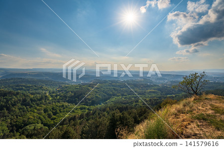 Layers of green mountains and hills in the haze during sunset. Panoramic View of Green hills and Meadow. Layers of green mountains and hills in the haze during sunset. Panoramic View of Green hills and Meadow. 141579616