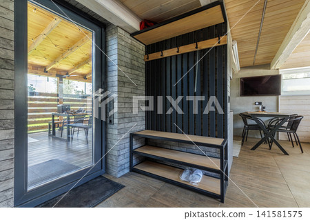 Modern Entrance Hallway Interior with Glass Door to Terrace Modern Entrance Hallway Interior with Glass Door to Terrace 141581575