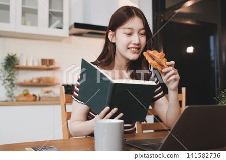 Asian woman using computer remote for business studying, watching online virtual webinar training meeting, video call. asian business woman talking on laptop in home office. Banner, copy space 141582736