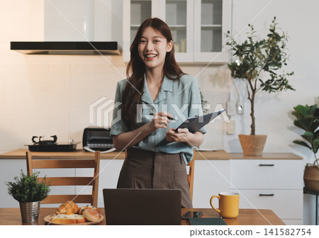 Young adult asian business woman using laptop chat digital artificial intelligence assistance ai chatbot prompt analysis work modern lifestyles Young adult asian business woman using laptop chat digital artificial intelligence assistance ai chatbot prompt analysis work modern lifestyles 141582754