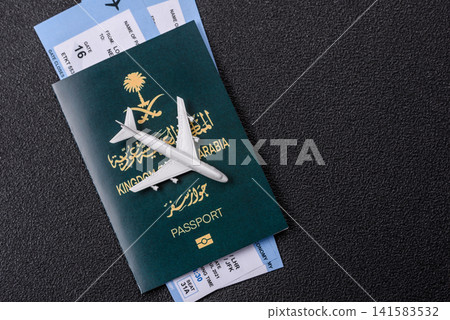 Saudi Arabia passport or id document with tickets for flight, travel. Saudi Arabia passport Saudi Arabia passport or id document with tickets for flight, travel. Saudi Arabia passport 141583532