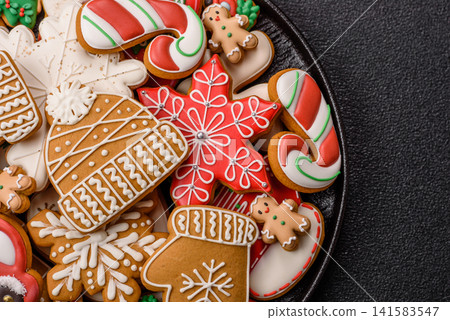 Gingerbread as a Christmas staple, sweet biscuits for the holiday table. Gingerbread as a backdrop Gingerbread as a Christmas staple, sweet biscuits for the holiday table. Gingerbread as a backdrop 141583547