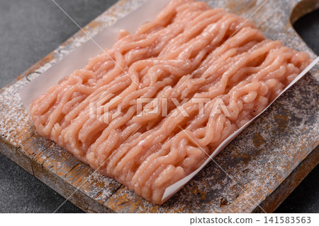 Fresh raw ground chicken, poultry meat for home cooking. Ground chicken Fresh raw ground chicken, poultry meat for home cooking. Ground chicken 141583563
