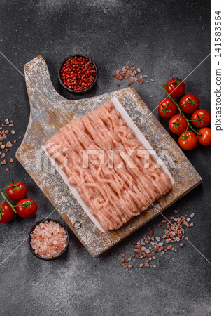 Fresh raw ground chicken, poultry meat for home cooking. Ground chicken Fresh raw ground chicken, poultry meat for home cooking. Ground chicken 141583564