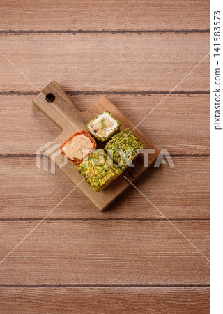 Turkish delight or lokum is a traditional Eastern sweet made with nuts. Turkish delight, lokum Turkish delight or lokum is a traditional Eastern sweet made with nuts. Turkish delight, lokum 141583573