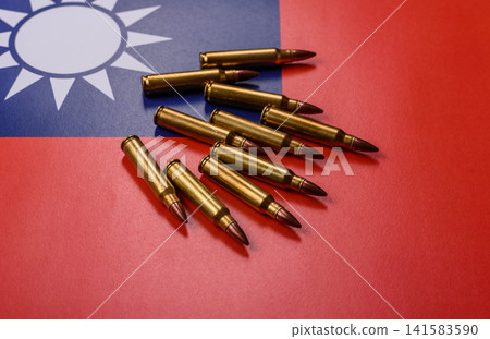 Assault rifle cartridges on the taiwanese flag, serving as a conceptual background for defense Assault rifle cartridges on the taiwanese flag, serving as a conceptual background for defense 141583590