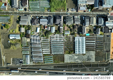An aerial photograph showing a rural area and greenhouses in Shizuoka City. An aerial photograph showing a rural area and greenhouses in Shizuoka City. 141583789