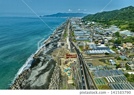 Aerial photographs capturing construction sites and residential areas along the coast of Shizuoka City. Aerial photographs capturing construction sites and residential areas along the coast of Shizuoka City. 141583790