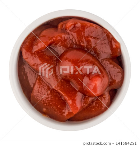 Top view of tomato paste or thick ketchup in a round white bowl isolated on white background Top view of tomato paste or thick ketchup in a round white bowl isolated on white background 141584251