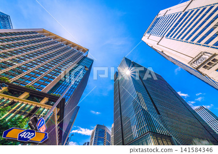 Tokyo cityscape, July 19th. View of the Otemachi and other business districts from the Otemachi Station intersection. Tokyo cityscape, July 19th. View of the Otemachi and other business districts from the Otemachi Station intersection. 141584346