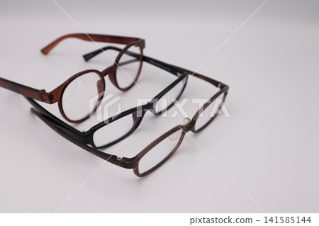 Close-ups of multiple pairs of glasses Close-ups of multiple pairs of glasses 141585144
