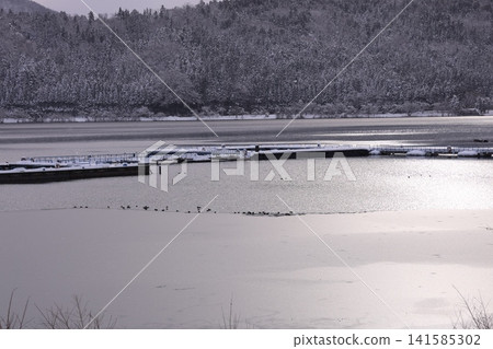 Snow-covered mountains and lake Snow-covered mountains and lake 141585302