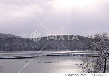 Snow-covered mountains and lake Snow-covered mountains and lake 141585303