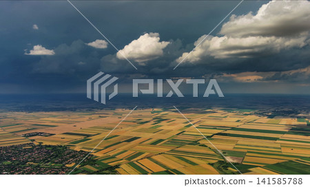 Agricultural fields under dramatic dark storm clouds Agricultural fields under dramatic dark storm clouds 141585788