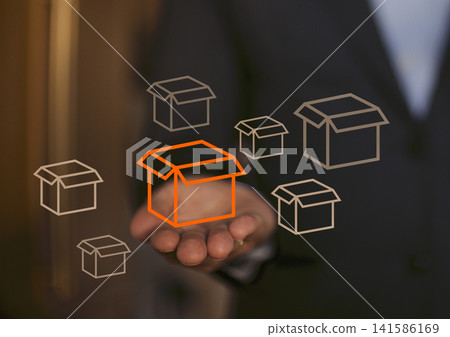Businessman in suit holding hand out with floating graphic boxes, one highlighted in orange, representing logistics, delivery, and packaging concepts in a modern office setting Businessman in suit holding hand out with floating graphic boxes, one highlighted in orange, representing logistics, delivery, and packaging concepts in a modern office setting 141586169