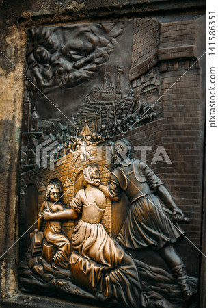 Bronze relief detail on the statue of St. John of Nepomuk Bronze relief detail on the statue of St. John of Nepomuk 141586351