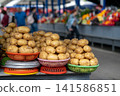 Baskets of potatoes on a stand at a farmers' market or bazaar. Potatoes displayed for sale, grocery store. 141586851