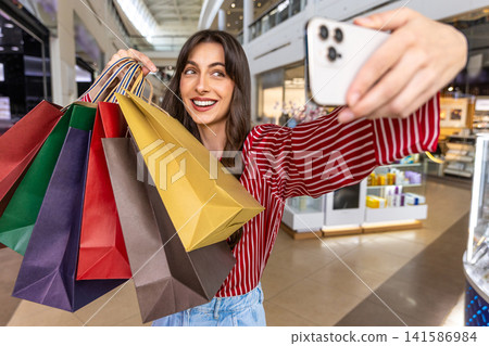 Pretty young caucasian woman making selfie and looking enjoyed Pretty young caucasian woman making selfie and looking enjoyed 141586984