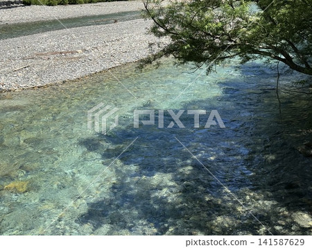 A clear summer day at Azusa River (Kamikochi, Matsumoto City, Nagano Prefecture; photo taken in July) A clear summer day at Azusa River (Kamikochi, Matsumoto City, Nagano Prefecture; photo taken in July) 141587629