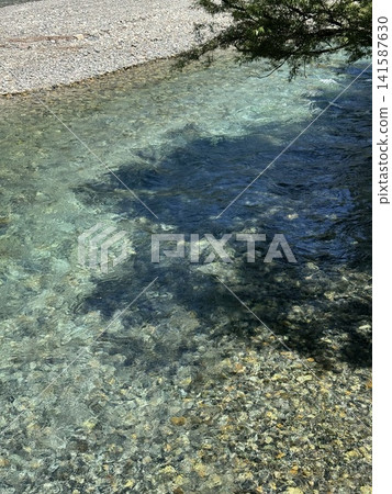 A clear summer day at Azusa River (Kamikochi, Matsumoto City, Nagano Prefecture; photo taken in July) A clear summer day at Azusa River (Kamikochi, Matsumoto City, Nagano Prefecture; photo taken in July) 141587630