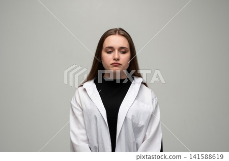 Young woman experiencing deep sadness and grief, feeling lonely and disappointed, expressing negative emotions Young woman experiencing deep sadness and grief, feeling lonely and disappointed, expressing negative emotions 141588619