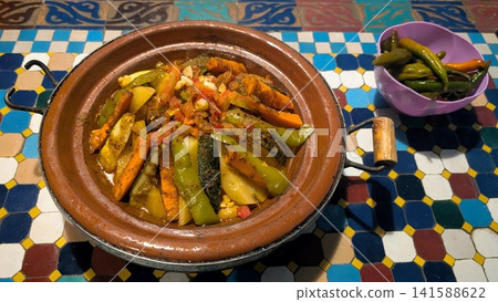 Traditional Moroccan Meat and Vegetable Tagine on Mosaic Table 141588622