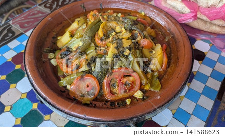 Traditional Moroccan Tagine with Meat and Sliced Tomatoes Traditional Moroccan Tagine with Meat and Sliced Tomatoes 141588623