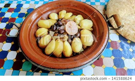 Traditional Moroccan Tagine with Potatoes Olives and Lemon Traditional Moroccan Tagine with Potatoes Olives and Lemon 141588624