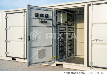 Industrial electrical cabinet with open doors revealing complex wiring and components Industrial electrical cabinet with open doors revealing complex wiring and components 141589168