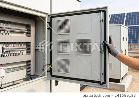Electrical control panel with wiring and ventilation, near solar panels Electrical control panel with wiring and ventilation, near solar panels 141589188