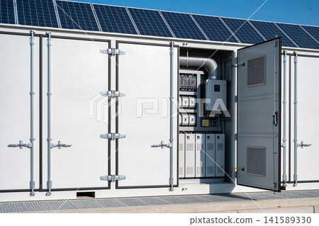 Modern solar power storage unit with open door revealing electrical components 141589330