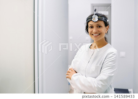 Portrait of otolaryngologist or audiologist. Healthcare occupations. ENT doctor Portrait of otolaryngologist or audiologist. Healthcare occupations. ENT doctor 141589433